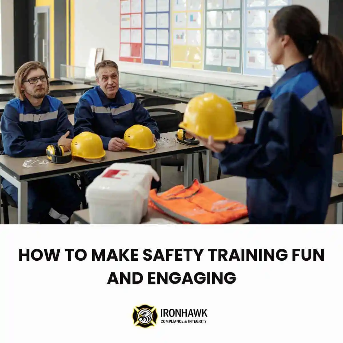 Two women and a man wearing PPE in a classroom for safety training.