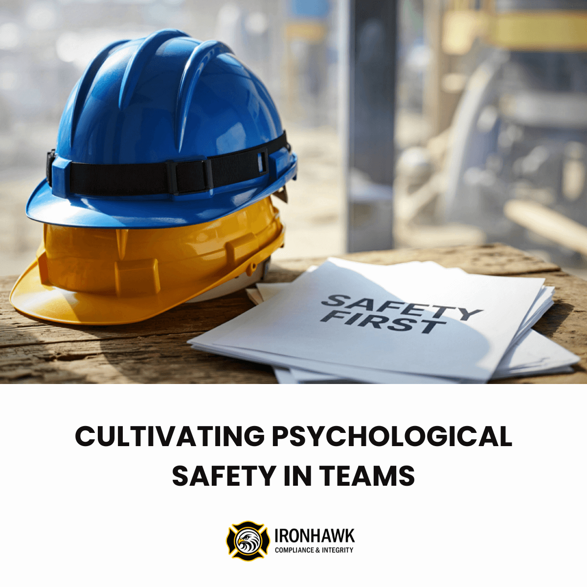 A blue hardhat stacked on top of a yellow hardhat on a desk next to papers that says "safety first."